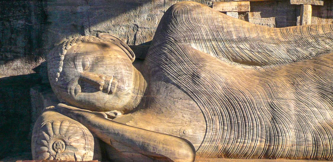 Majestic stone reclining Buddha statue at the ancient Gal Vihara temple in Polonnaruwa