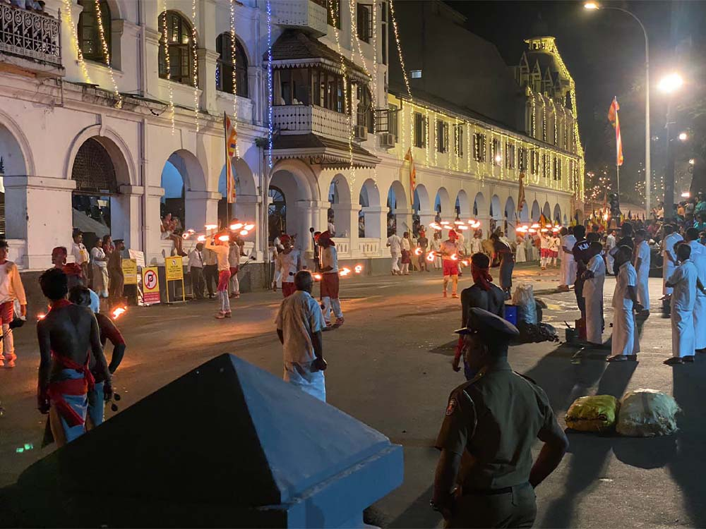 Kandy Esala Perahera fireball acrobats performing during the sacred night procession in Sri Lanka