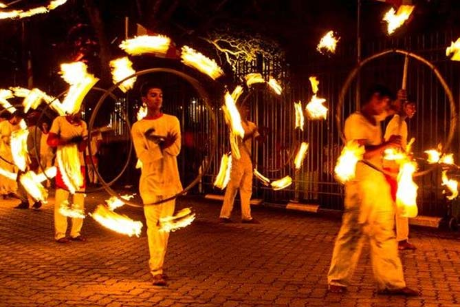 Fireball acrobats and firecrackers clearing the path during the Kandy Perahera