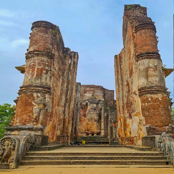 The soaring, 50-foot-high ancient brick walls of the Lankatilaka Image House in Polonnaruwa, Sri Lanka.