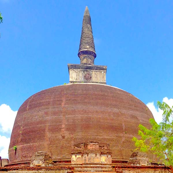 The massive, iconic brick dome of the Rankoth Vehera stupa, the largest historical monument in Polonnaruwa, Sri Lanka.