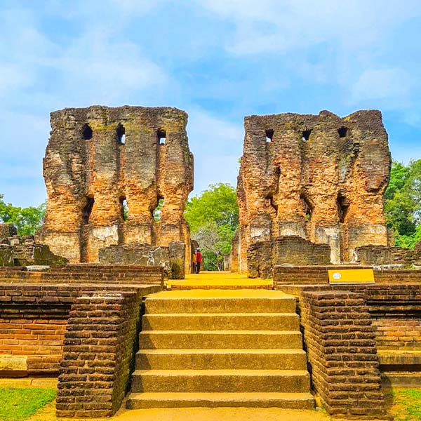 The ancient, thick brick wall ruins of the Royal Palace of King Parakramabahu I in the historic city of Polonnaruwa.