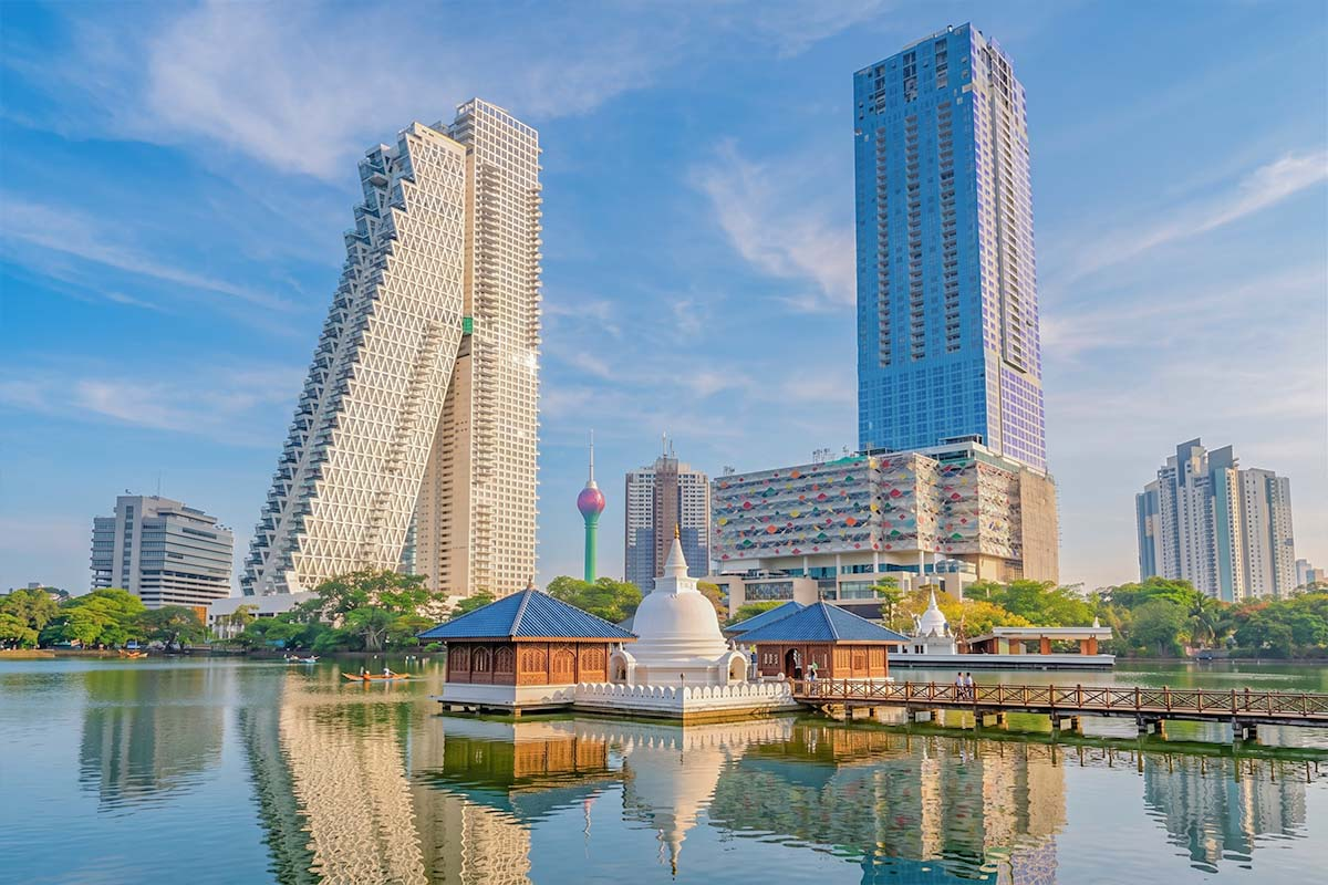  overlooking Beira Lake with the Colombo city skyline and the Lotus Tower in the background.
