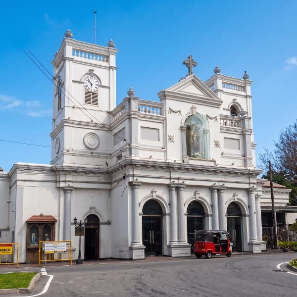 White facade and architectural details of the historic St. Anthony's Shrine in Kotahena during a Colombo city tour