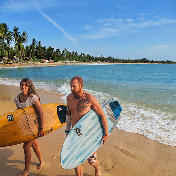 Surfers are coming back from surfing at the Arugam Bay surfing point